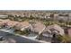 Aerial view of residential neighborhood featuring well-maintained homes with tile roofs at 3957 Genoa Dr, Las Vegas, NV 89141