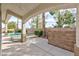 Covered outdoor living space with a view of the pool, spa, and landscaping at 3957 Genoa Dr, Las Vegas, NV 89141