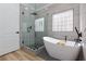 Modern bathroom featuring a glass shower and free standing tub at 3957 Genoa Dr, Las Vegas, NV 89141