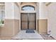 Inviting front entrance showcasing a secure, double-door design and textured stucco at 3957 Genoa Dr, Las Vegas, NV 89141