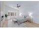 Spacious main bedroom featuring a ceiling fan, decorative rug and lots of natural light at 3957 Genoa Dr, Las Vegas, NV 89141