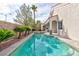 Backyard pool and spa surrounded by desert landscaping at 3957 Genoa Dr, Las Vegas, NV 89141