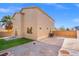 Large backyard featuring a covered patio, desert landscaping, and a fenced perimeter at 430 Shimmering Sands Ave, North Las Vegas, NV 89031