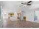 Spacious living room with wood floors flowing into the kitchen at 430 Shimmering Sands Ave, North Las Vegas, NV 89031