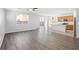 Open-concept living area with wood floors flowing into an island kitchen at 430 Shimmering Sands Ave, North Las Vegas, NV 89031