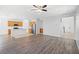 Open concept living area features wood flooring, modern lighting, and neutral paint at 430 Shimmering Sands Ave, North Las Vegas, NV 89031