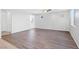 Spacious living room with wood flooring, neutral walls, and ample natural light at 430 Shimmering Sands Ave, North Las Vegas, NV 89031