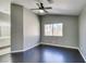 Bedroom featuring a ceiling fan, gray walls, dark wood-look floors, and a window at 4421 Rodman Dr, Las Vegas, NV 89130