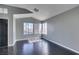 Living room with hardwood floors, multiple windows, and a view of the front yard at 4421 Rodman Dr, Las Vegas, NV 89130