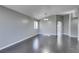 Open-concept living room featuring dark hardwood floors and neutral paint at 4421 Rodman Dr, Las Vegas, NV 89130