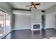 Living room with dark wood floors, fireplace and sliding glass doors at 4421 Rodman Dr, Las Vegas, NV 89130