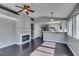 Living room with dark wood floors, fireplace, breakfast bar and ample natural light at 4421 Rodman Dr, Las Vegas, NV 89130