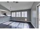 Living room with dark wood floors and lots of natural light at 4421 Rodman Dr, Las Vegas, NV 89130