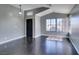 Bright living room features dark wood floors, vaulted ceilings, and plenty of natural light at 4421 Rodman Dr, Las Vegas, NV 89130