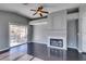 Living room with sliding glass doors, fireplace and dark wood floors at 4421 Rodman Dr, Las Vegas, NV 89130