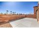 Private backyard featuring a concrete patio and low-maintenance landscaping at 4473 Oberlander Ave, North Las Vegas, NV 89031