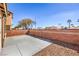 Private backyard featuring a concrete patio and low-maintenance landscaping at 4473 Oberlander Ave, North Las Vegas, NV 89031