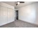 This bedroom features neutral carpet, a window and a closet with sliding doors at 4473 Oberlander Ave, North Las Vegas, NV 89031