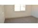 The bedroom features two windows and neutral carpet at 4473 Oberlander Ave, North Las Vegas, NV 89031