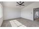 Sun-filled bedroom featuring gray carpet, neutral walls, and a doorway to other rooms at 4473 Oberlander Ave, North Las Vegas, NV 89031