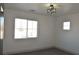 Well lit bedroom with large window, neutral walls, and modern light fixture at 4473 Oberlander Ave, North Las Vegas, NV 89031