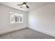 This bright bedroom has a window, and neutral carpet at 4473 Oberlander Ave, North Las Vegas, NV 89031