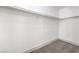 This walk-in closet has neutral carpet and white walls at 4473 Oberlander Ave, North Las Vegas, NV 89031