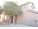 The front of the home features desert landscaping and a covered porch at 4473 Oberlander Ave, North Las Vegas, NV 89031