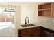 Kitchen with wine rack, stainless steel appliances, black hardware, and bright countertops at 4473 Oberlander Ave, North Las Vegas, NV 89031