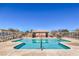 Community pool area featuring a pool, seating area, and a restroom building at 4473 Oberlander Ave, North Las Vegas, NV 89031