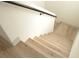 Staircase with sleek metal railing and light wood stairs at 4473 Oberlander Ave, North Las Vegas, NV 89031