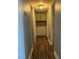 Clean hallway features hardwood flooring, neutral paint, and built-in storage cabinets at 4504 Cinderella Ln, Las Vegas, NV 89102