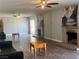 A spacious living room featuring a fireplace and mirrored walls at 4504 Cinderella Ln, Las Vegas, NV 89102