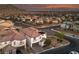 Beautiful aerial shot of a neighborhood with mountain views at sunset at 4504 Eagle Nest Peak St, Las Vegas, NV 89129