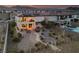 An aerial view showcasing a spacious backyard oasis with a patio, pool, and desert landscaping at 4504 Eagle Nest Peak St, Las Vegas, NV 89129