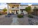 An outdoor living space featuring a patio, outdoor seating, and drought-resistant landscaping at 4504 Eagle Nest Peak St, Las Vegas, NV 89129