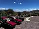 Beautiful backyard patio area with nice landscaping and comfortable lounge chairs overlooking the desert at 4504 Eagle Nest Peak St, Las Vegas, NV 89129