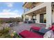 Large backyard patio featuring an outdoor kitchen, outdoor furniture and decorative string lights at 4504 Eagle Nest Peak St, Las Vegas, NV 89129