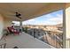 Second-story balcony offering views of the neighborhood and distant mountains, perfect for relaxing outdoors at 4504 Eagle Nest Peak St, Las Vegas, NV 89129