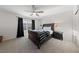 The bedroom features a dark-wood bed frame with a striped blanket and a window at 4504 Eagle Nest Peak St, Las Vegas, NV 89129