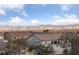 Expansive Las Vegas city view in a residential area during the day under a bright blue sky with clouds at 4504 Eagle Nest Peak St, Las Vegas, NV 89129