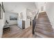 Entryway features wood stairs, decorative art, and wood-look laminate flooring at 4504 Eagle Nest Peak St, Las Vegas, NV 89129