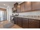 Kitchen features stainless steel appliances, granite countertops, and dark wood cabinetry at 4504 Eagle Nest Peak St, Las Vegas, NV 89129