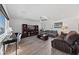 Bright living room with hardwood floors, stylish furniture, perfect for relaxing and entertaining at 4504 Eagle Nest Peak St, Las Vegas, NV 89129