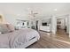 Spacious main bedroom featuring hardwood floors, and ample natural light from the large window at 4504 Eagle Nest Peak St, Las Vegas, NV 89129