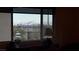 A large picture window provides a clear view of mountains and cityscape at 4504 Eagle Nest Peak St, Las Vegas, NV 89129