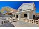 Inviting backyard patio featuring covered area with detailed columns and a charming decorative railing at 4839 Englewood Ave, Las Vegas, NV 89139