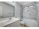 Tastefully updated bathroom with sleek fixtures, stylish marble tile and built in shower niche at 4839 Englewood Ave, Las Vegas, NV 89139