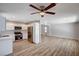 Open concept kitchen with stainless steel appliances, seamlessly flowing into a bright and spacious living room at 4839 Englewood Ave, Las Vegas, NV 89139