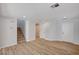 Inviting living room with carpeted stairs, light walls and floors, and a bright entrance door at 4839 Englewood Ave, Las Vegas, NV 89139